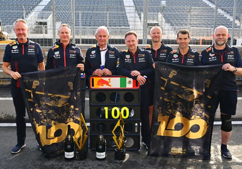 MONTREAL, QUEBEC - JUNE 18: The seven team members of the Red Bull Racing team that have been present for all 100 race wins, (L-R) Red Bull Racing Team Manager Jonathan Wheatley, Red Bull Racing Head of Car Engineering Paul Monaghan, Red Bull Racing Team Consultant Dr Helmut Marko, Red Bull Racing Team Principal Christian Horner, Ole Schack, mechanic at Red Bull Racing, Chris Gent, mechanic at Red Bull Racing and Richard Tomlinson of Red Bull Racing, pose for a photo after the F1 Grand Prix of Canada at Cir