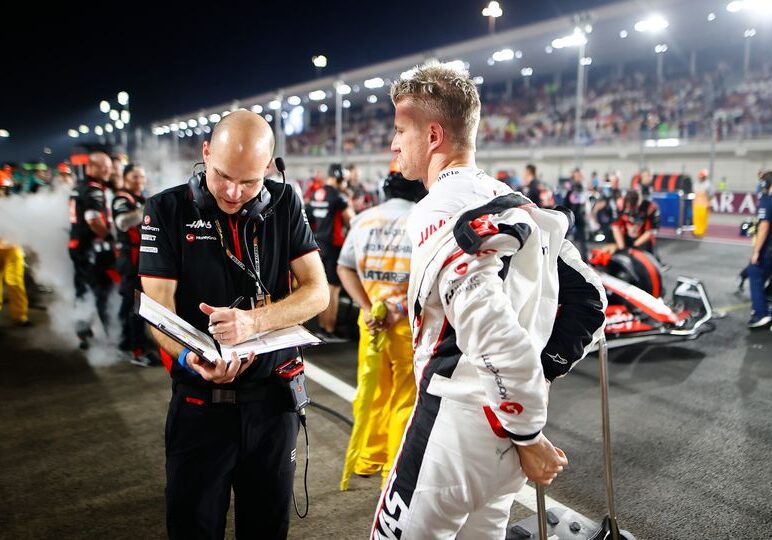 LOSAIL INTERNATIONAL CIRCUIT, QATAR - OCTOBER 08: Nico Hulkenberg, Haas F1 Team, on the grid with his engineer during the Qatar GP at Losail International Circuit on Sunday October 08, 2023 in Losail, Qatar. (Photo by Andy Hone / LAT Images)