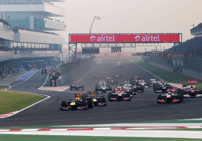 NOIDA, INDIA - OCTOBER 28:  Sebastian Vettel of Germany and Red Bull Racing leads the field into the first corner at the start of the Indian Formula One Grand Prix at Buddh International Circuit on October 28, 2012 in Noida, India.  (Photo by Mark Thompson/Getty Images) *** Local Caption *** Sebastian Vettel
