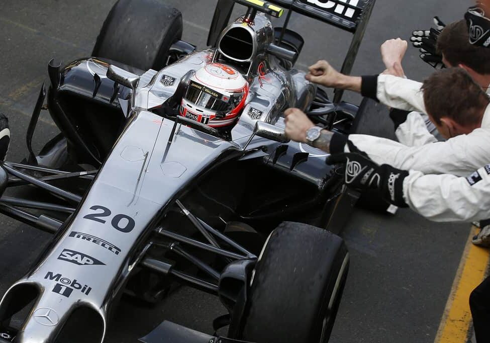 Kevin Magnussen returns to the pits after a podium finish to the cheers of the team.