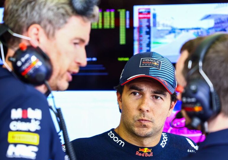 BAHRAIN, BAHRAIN - FEBRUARY 22: Sergio Perez of Mexico and Oracle Red Bull Racing looks on in the garage during day two of F1 Testing at Bahrain International Circuit on February 22, 2024 in Bahrain, Bahrain. (Photo by Mark Thompson/Getty Images)