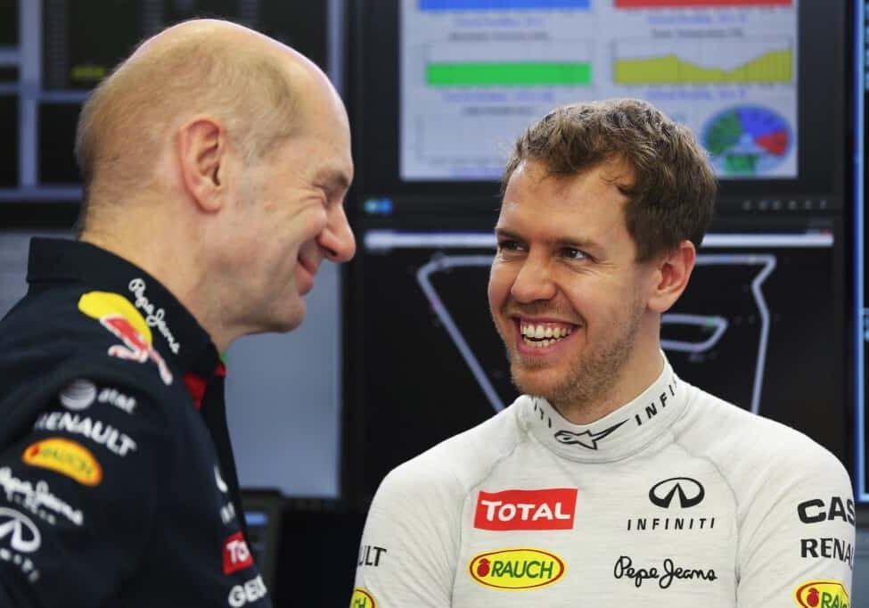 Sebastian Vettel of Germany and Infiniti Red Bull Racing talks with Infiniti Red Bull Racing Chief Technical Officer Adrian Newey in their team garage during day three of Formula One Winter Testing at the Bahrain International Circuit in Bahrain, Bahrain on March 1, 2014