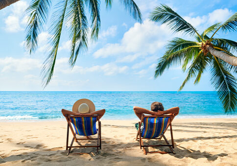 Couple relax on the beach enjoy beautiful sea on the tropical island. Summer beach vacation concept